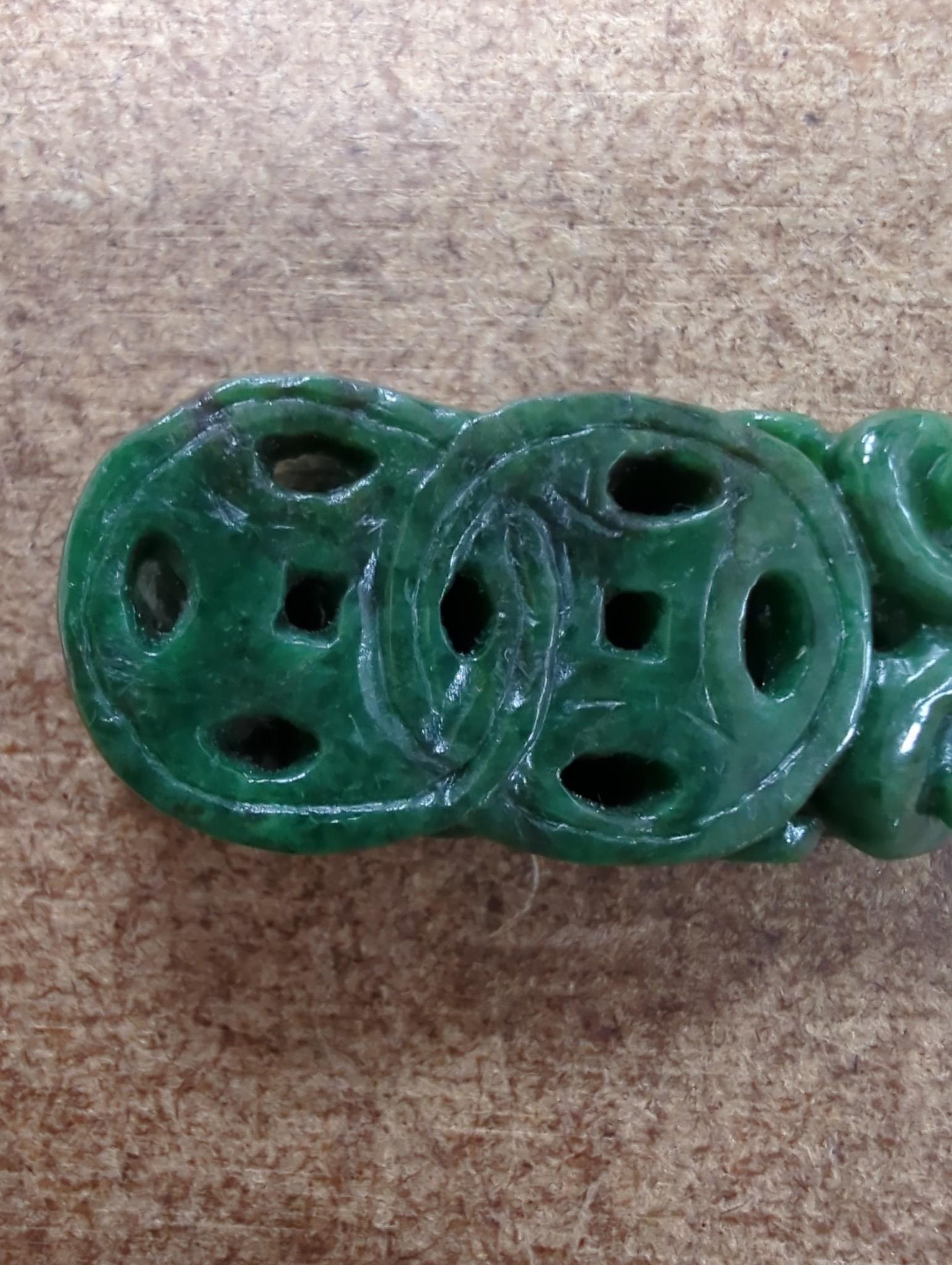 A Chinese Jadeite carving of two cash and a chilong, 3.7cm